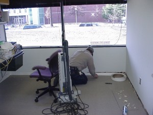 a physical plan staff is fixing an office floor
